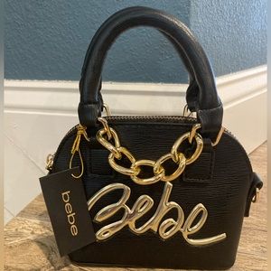 NWT Bebe black mini pocketbook w/ gold handle and detachable crossbody strap